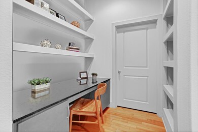 The sizeable study area features a built-in desk,
