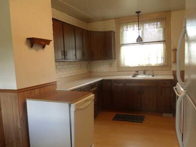 Kitchen. Kitchen offers wood laminate flooring, el