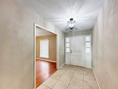 Entry leads to dining room and living area.