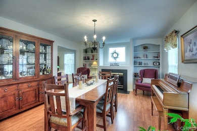 Dining room with gas fireplace & bookcases! Could be used as formal living room.