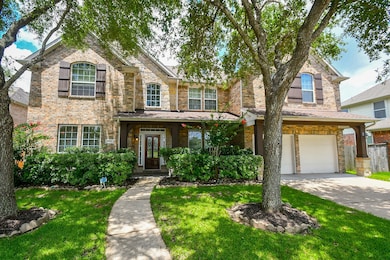 This charming two-story brick home features a welc