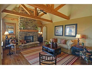 Incredible hearth room with wagon wheel beams and 