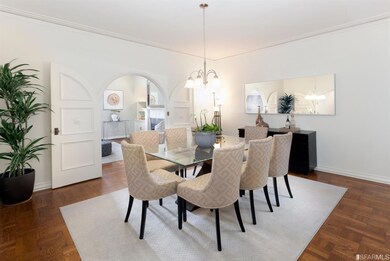 Formal dining room showing the arched doorway thro