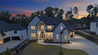 View of front of property featuring concrete driveway and an attached garage
