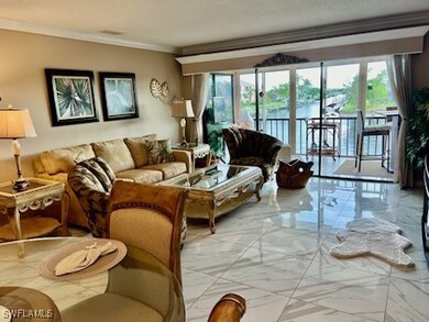 Living room with plenty of natural light and crown