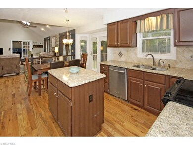 Updated kitchen with granite counters, tiled backs