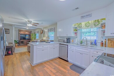 Kitchen with a healthy amount of sunlight, applian