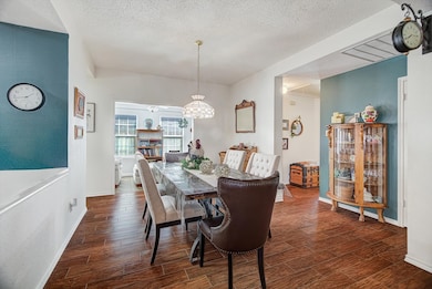 Dining Area (Angle 2) – Additional view of the dining room with access to the sun-filled bonus room at the back of the home.