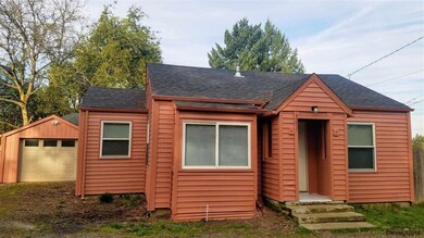 Straight front side with garage in view.