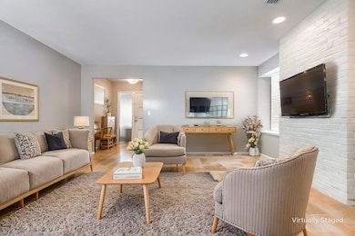 Virtually Staged Living room, there is a fireplace