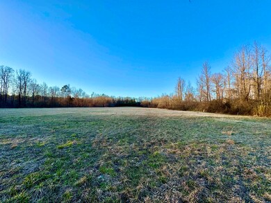 View of yard with a rural view