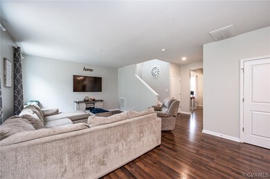 Family room with view of stairs to 2nd level, clos