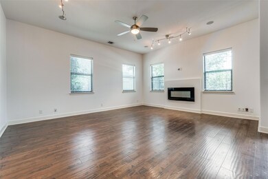 Unfurnished living room with dark wood-type floori