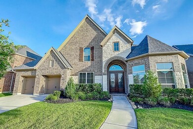 Double wrought iron and leaded glass doors beckons your guests