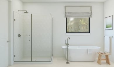 Primary bath with freestanding tub and glass shower enclosure