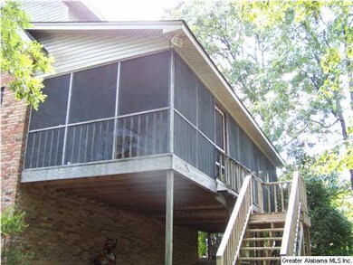 BACK OF HOME FULL SCREENED PORCH.