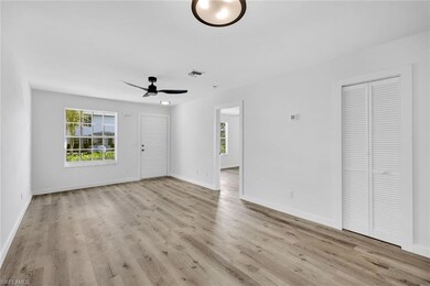 Unfurnished living room with wood finished floors,