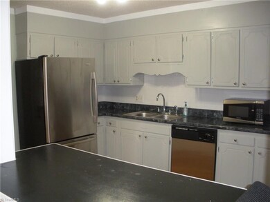 Kitchen with bar area for sitting.