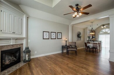 Gleaming hardwood floors throughout the open conce