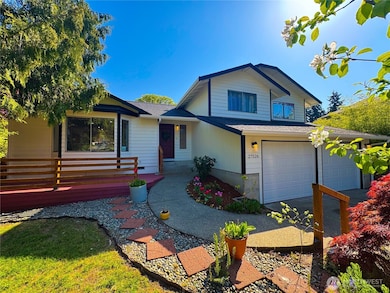 From front left side of the house showcasing its landscaping details.
