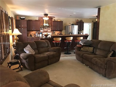 Living room opens to kitchen