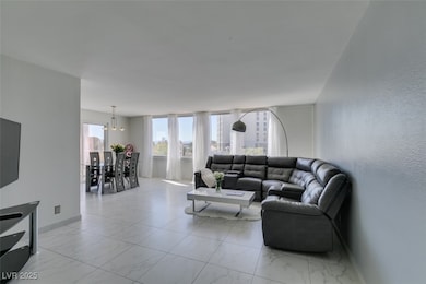 Living room featuring marble finish floor, baseboa