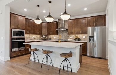 Bright kitchen with an expansive center island perfect for gatherings *Model representation
