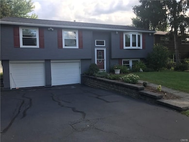 Large two car garage with parking for six cars in 