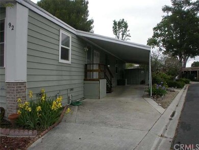 Room for a few cars in the carport, note the stora