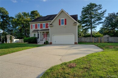View of front of property with garage and a front