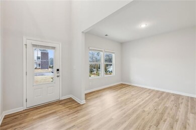 Foyer entrance with light wood finished floors