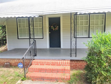 Doorway to property with covered porch