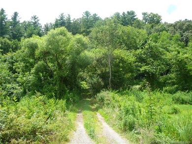 Property begins to the right of drive into 208 Aye