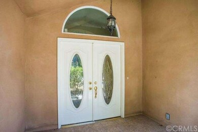COVERED ENTRY HAS DOUBLE ENTRY DOORS