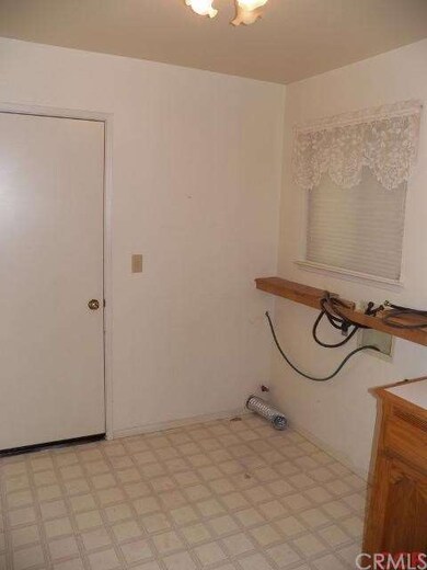 In-door laundry sits just off the kitchen and dini