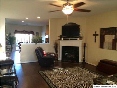 Nice large living room with a corner fireplace.
