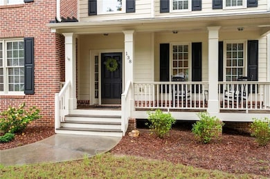 Cozy front porch with space for rocking chairs — perfect for relaxing.