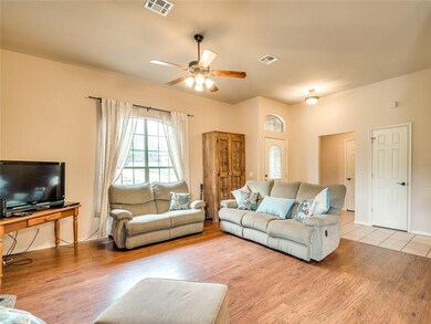 SPACIOUS LIVING ROOM WITH NEW FLOORING! ENTRY HAS 