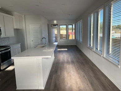 Kitchen featuring stainless steel gas stove, heal