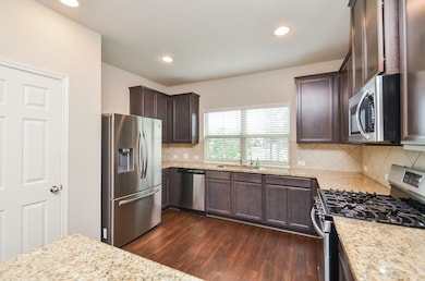 The compact, yet truly workable kitchen features r