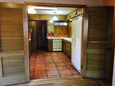 Kitchen offers french folding doors to create an o