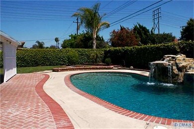 Huge back yard w/pool & waterfall.