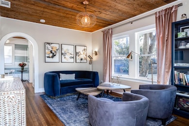 Living room with wooden ceiling, wood finished fl