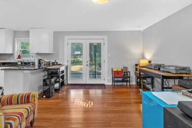Living area with french doors, wood finished floo