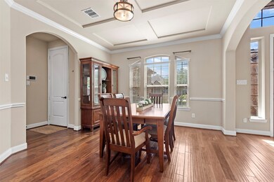 The dining room's location at the front of the home is inviting to guests who experience a sense of grandeur from the moment they enter the home.   What an elegant statement upon entry.