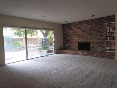 Huge family room with a beautiful brick fireplace and lots of natural light.....