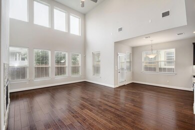 Unfurnished living room featuring ceiling fan, a 