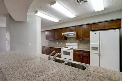 Gorgeous granite breakfast bar for informal meals or just hanging out with a cup of coffee!