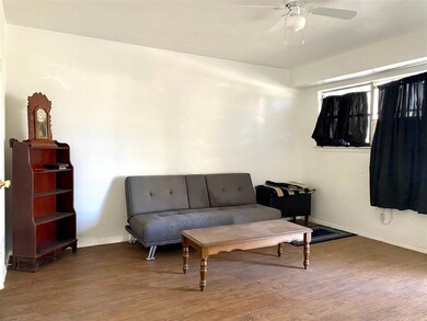 Front Living Room featuring ceiling fan and hardwo