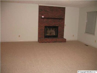 Spacious family room offers cozy wood burning fireplace to keep you warm on those chilly winter nights, fresh paint and carpet!